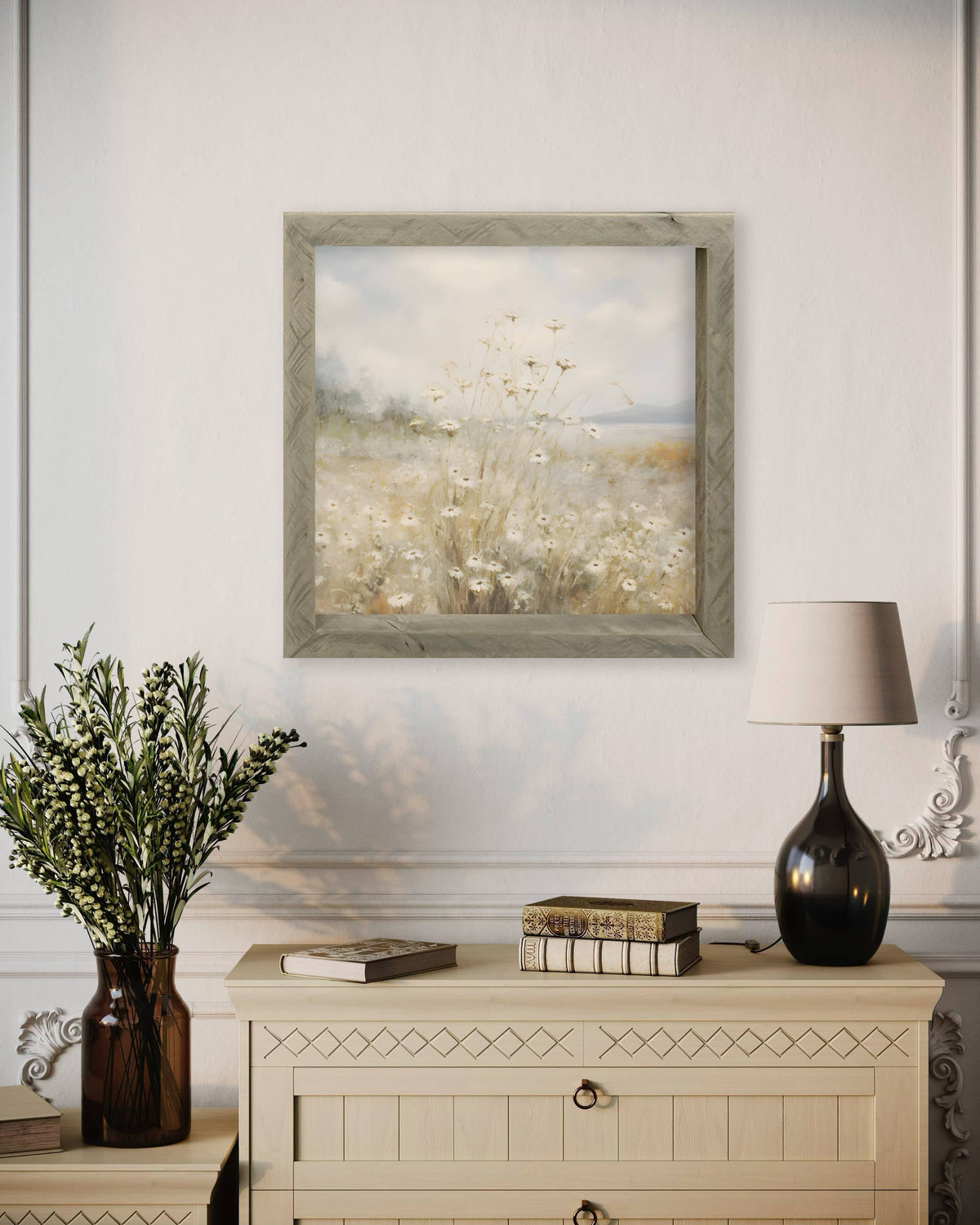 Framed wall art hangs above a styled tabletop
