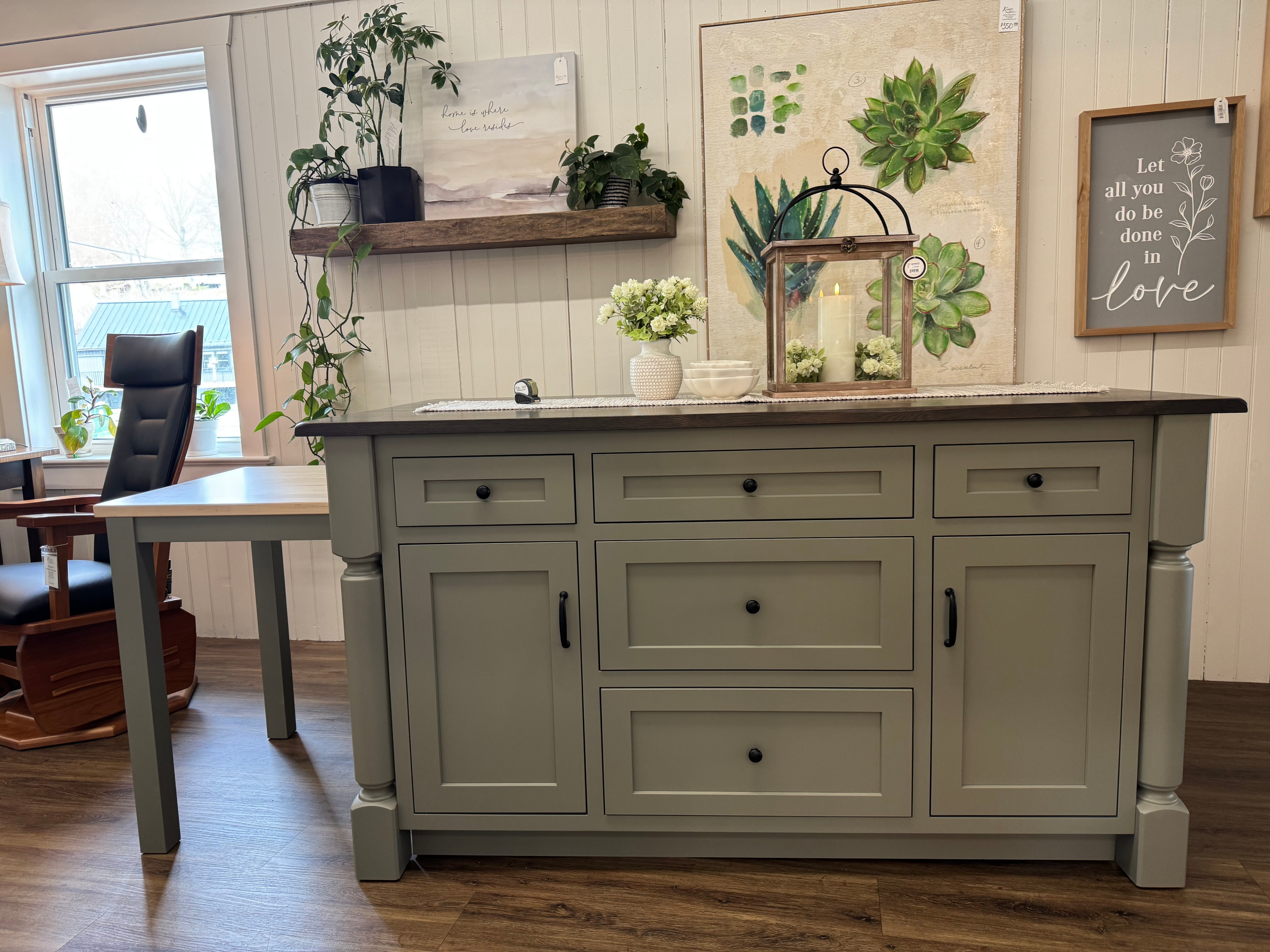 Front view of an Amish made solid hardwood kitchen island with five drawers and two doors and a slide out table extension on the left side - handcrafted furniture